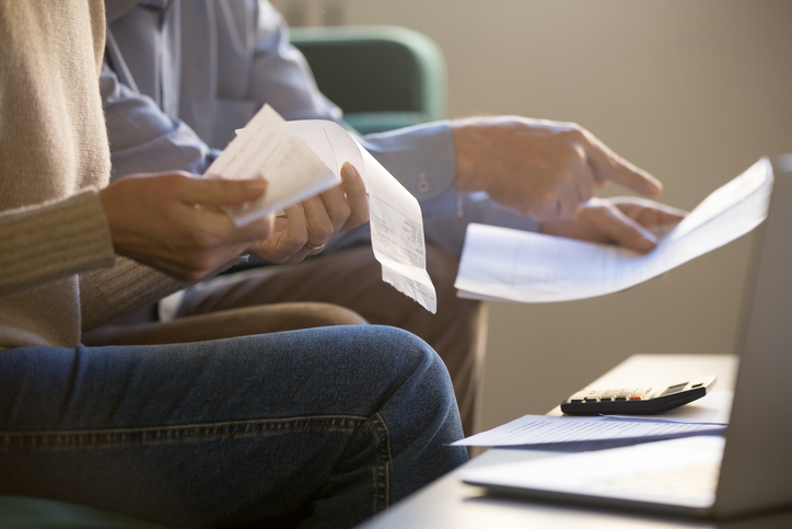 spouses reviewing paperwork - Lake Charles community property partitions lawyer